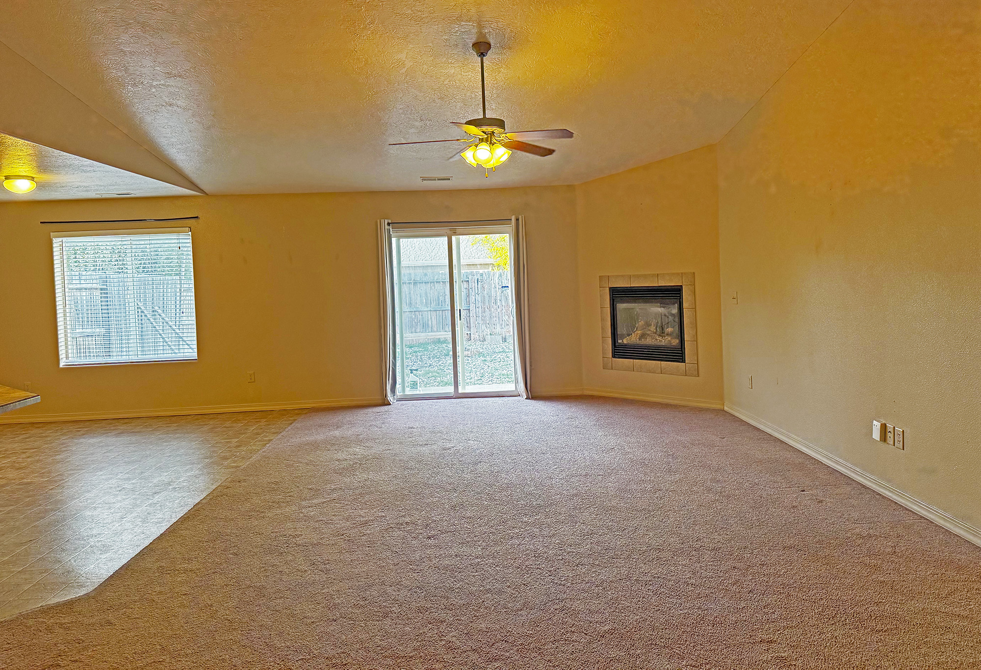 Great Room with patio door and fireplace